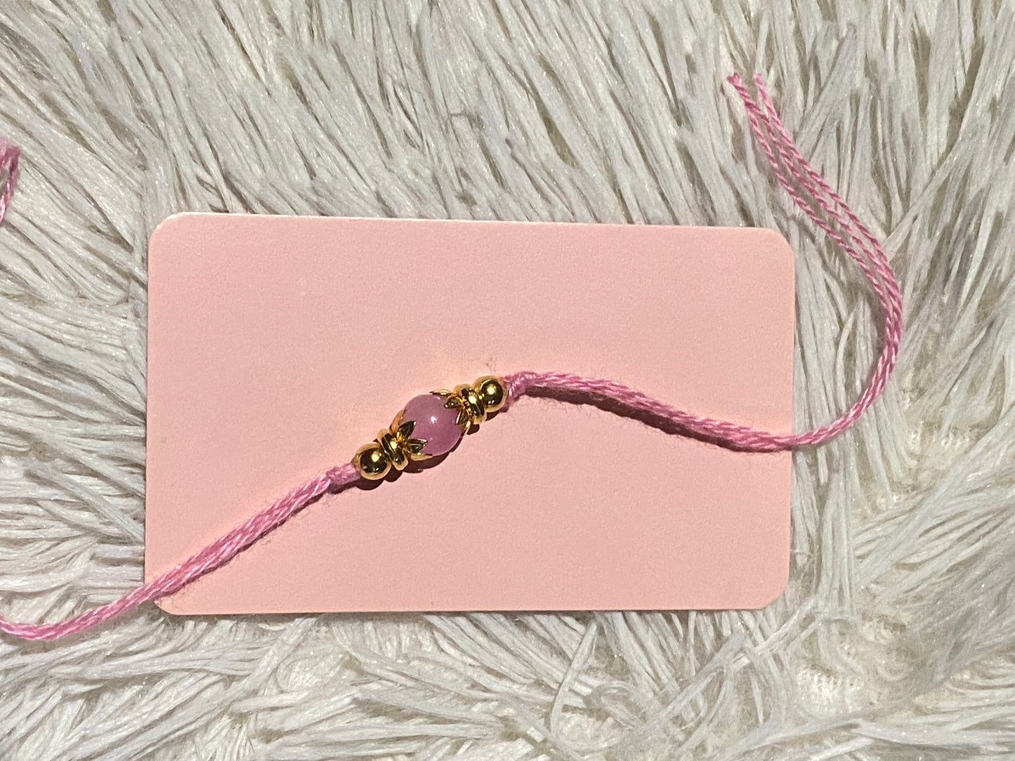 🌸 Minimal Pink Bead & Gold Rakhi (Pack of 12)