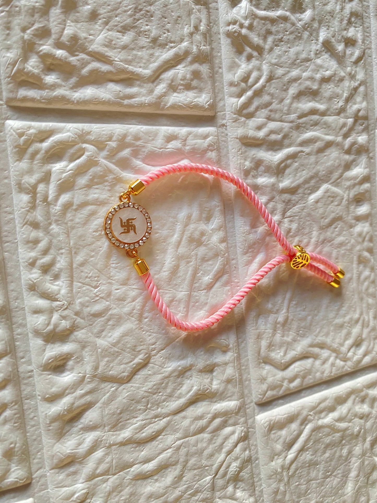 Handcrafted Pink Swastik Charm Rakhi |