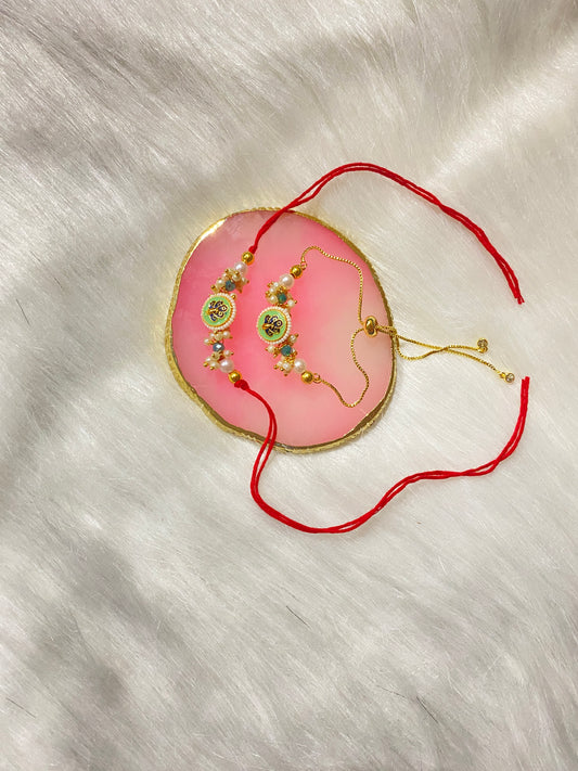 🦚 Peacock Rakhi Set of 2 | Traditional Rakhi for Couples with Beads & Pearls