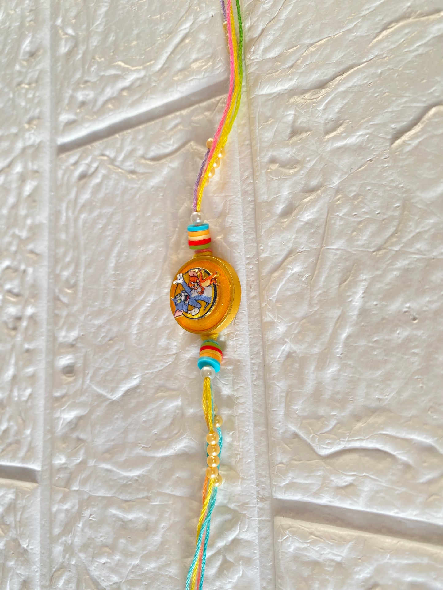 Cartoon theme Spinning Rakhi for kids