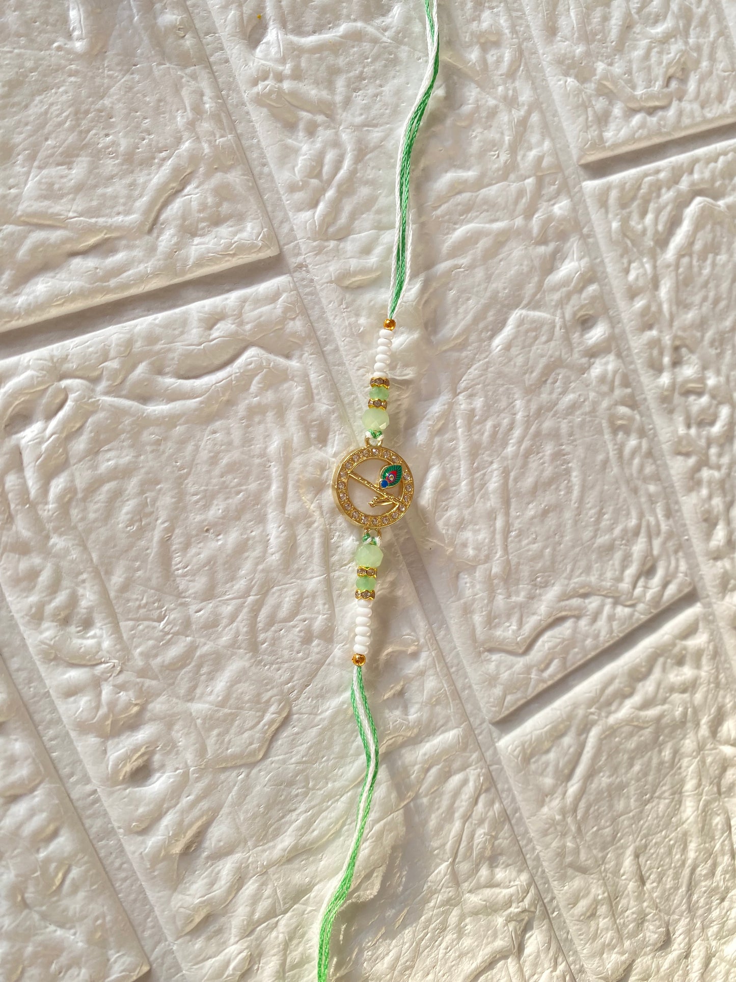 Handcrafted Krishna Feather Charm Rakhi