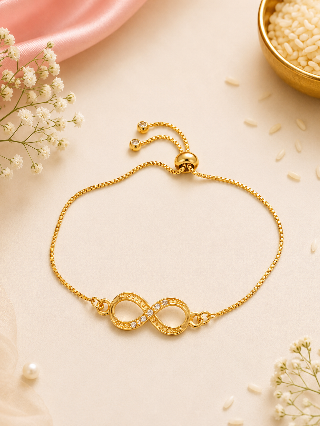 Gold Infinity Rakhi Bracelet – Adjustable Symbol of Forever Bond